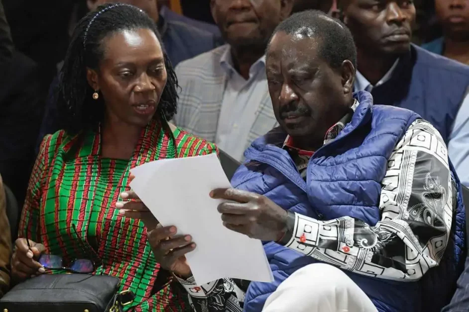Kenya's Azimio La Umoja Party (One Kenya Coalition Party) presidential candidate Raila Odinga and his running mate Martha Karua look at a document at the Milimani High Court in Nairobi on August 22, 2022. PHOTO | AFP