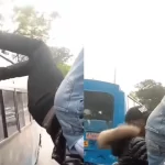 Conductor hanging on a speeding matatu