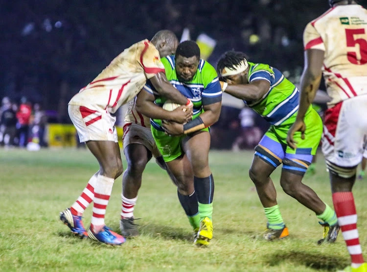KCB prop Curtis Lilako shrugs off Nondies skipper Steve Odhiambo in the Impala floodlit final. KCB face Quins this weekend in the Kenya Cup (Photo: Courtesy)