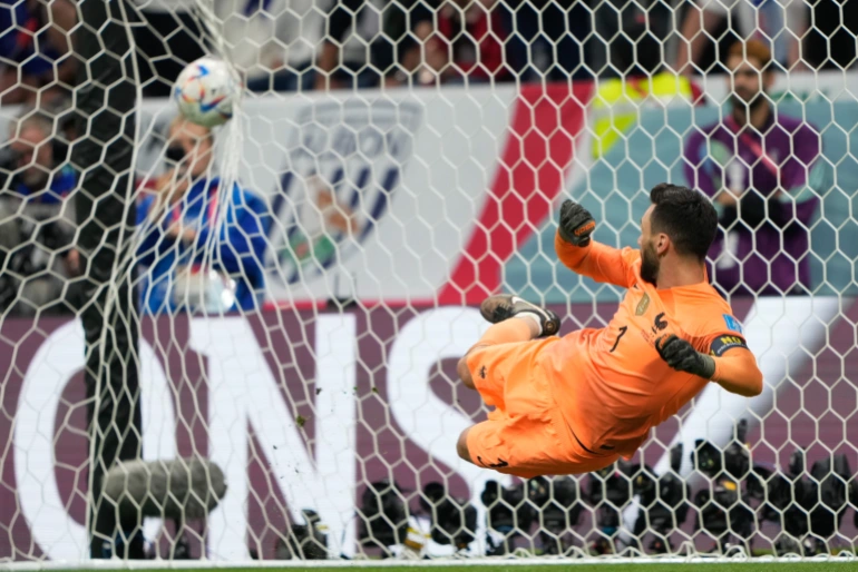 Harry Kane converts against France goalkeeper Hugo Lloris in the World Cup (Sorin Furcoi/Al Jazeera)