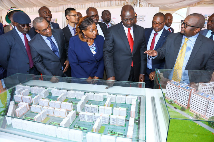 William Ruto and government officials during a display of affordable housing projects.