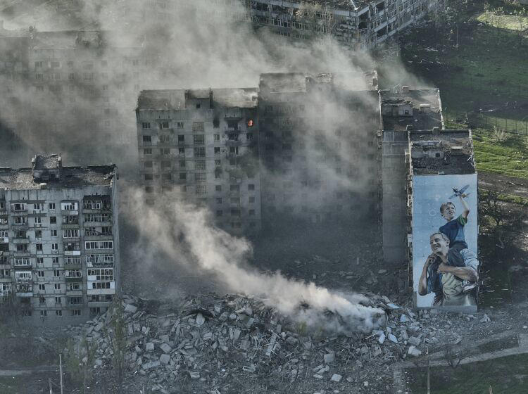 Smoke rises from a building in Bakhmut CAPITAL OF UKRAINE, the site of the heaviest battles with the Russian troops in the Donetsk region, Ukraine, Wednesday, April 26, 2023.  (AP Photo/Libkos, File) ((Libkos / Associated Press))