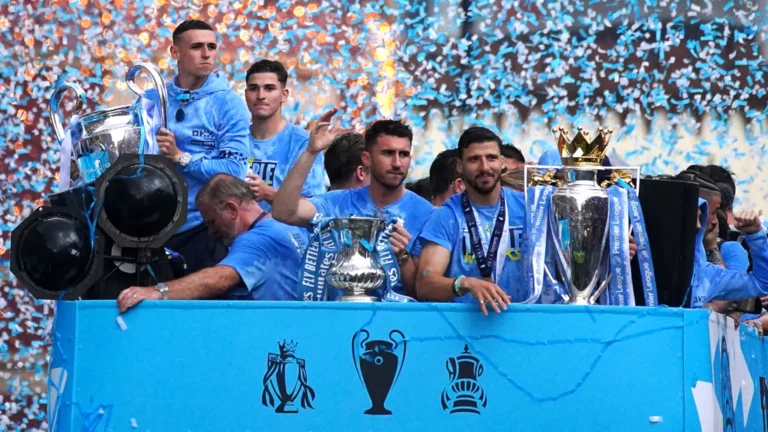 Manchester City dance in the rain as they celebrate winning treble
