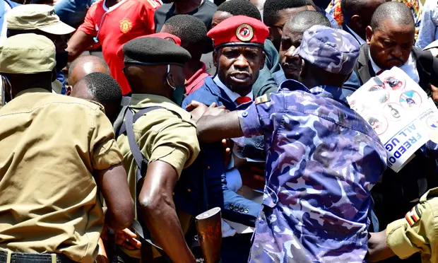The Ugandan opposition leader and singer Robert Kyagulanyi, known as Bobi Wine, is detained during an anti-government demonstration in Kampala in 2021. Photograph: Abubaker Lubowa Photo/Courtesy