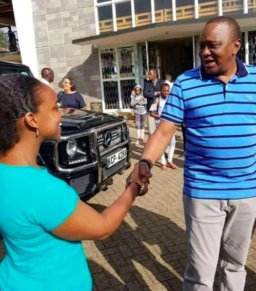 Uhuru Kenyatta pictured outside Holy Family Basilica, Nairobi, on March 17, 2019. Behind him is his black Mercedes Benz G-Wagon. [Photo/Courtesy]