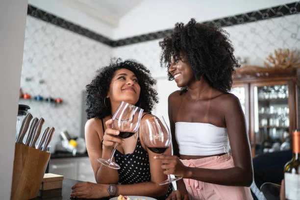 Two women drinking alcohol