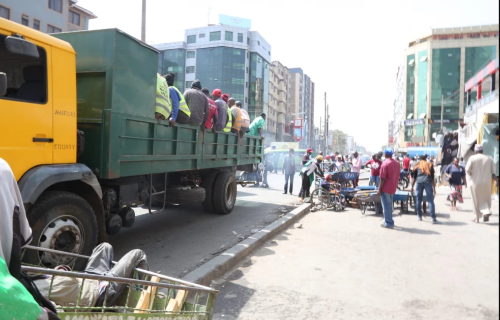 Nairobi residents in Eastleigh 1st Avenue during a cleaning exercise job in the region. 