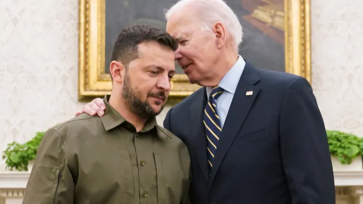 U.S. President Joe Biden puts his arm around Ukrainian President Volodymyr Zelenskyy and whispers to him as they meet in the Oval Office of the White House in Washington, September 21, 2023. Kevin Lamarque | Reuters