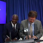 Equity Group Managing Director and CEO Dr. James Mwangi (left) and John Deere, Head of Business for Africa, Asia and the Middle East, Jason Brantley (right) sign a financing and collaboration agreement between Equity Group Holdings and John Deer/COURTESY