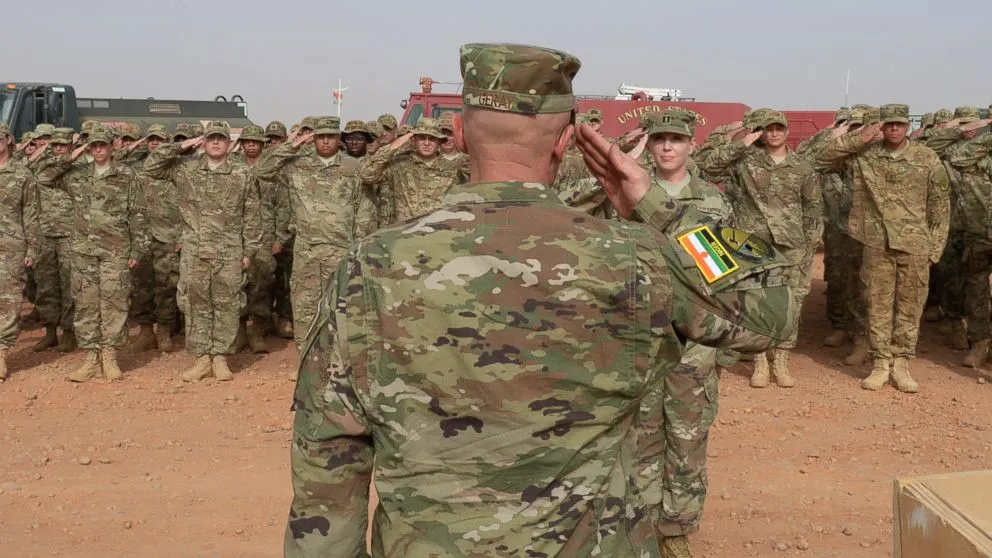 Lt. Col. Chance Geray returns his new squadron's first salute during a change of command ceremony at Nigerien Air Base 201, Niger, May 15, 2017. [Photo/ABCNews]