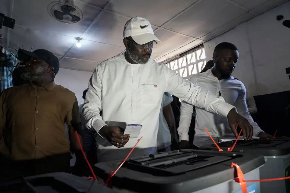 Leader of Liberia's ruling party Coalition for Democratic Change(CDC), President and former soccer player George Weah, prepares to cast his vote during the presidential elections in Monrovia, Liberia October 10, 2023. [Photo/REUTERS] Liberia