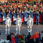 Chinese astronauts Tang Hongbo, Tang Shengjie and Jiang Xinlin attend a see-off ceremony before the launch of the Long March-2F carrier rocket, carrying the Shenzhou-17 spacecraft for a crewed mission to China's Tiangong space station, at Jiuquan Satellite Launch Center near Jiuquan, Gansu province, China October 26, 2023. China Daily via REUTERS