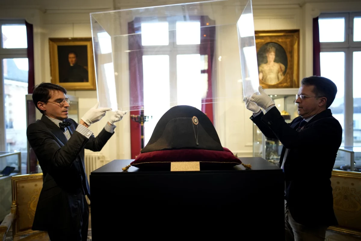 A faded and cracked felt bicorne hat worn by Napoléon Bonaparte sold for $2.1 million at an auction Sunday of the French emperor’s belongings.