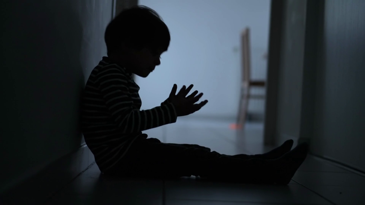 videoblocks-one-scared-desperate-child-covering-face-in-fear-sitting-in-dark-corridor-a_hebl9f3np_thumbnail-1080_01