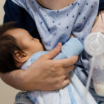 mom feed breastmilk and pump milk into bottle