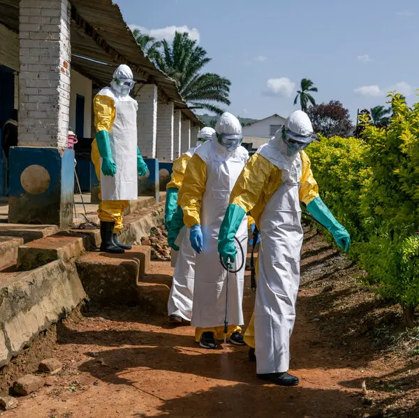 Health workers gather outside the Ebola treatment centre in Rwampara during a protest over unpaid wages amid the ongoing Ebola outbreak in eastern DR Congo.