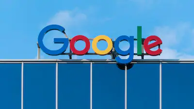 Google Play logo displayed on a smartphone, representing the EU fine over restrictions on app developers and Google's response to the ruling.