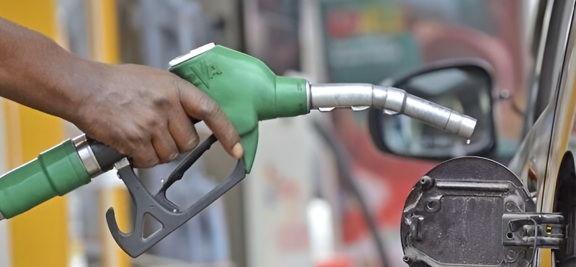 Motorists refuelling at a petrol station as the government announces a fuel subsidy and extends the reduced 8 per cent VAT to cushion consumers from higher fuel costs.