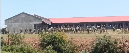 Security officers on duty during the Ol Kalou parliamentary by-election after authorities warned against unmarked vehicles and reminded supporters to stay 400 metres from polling stations amid heightened tensions.