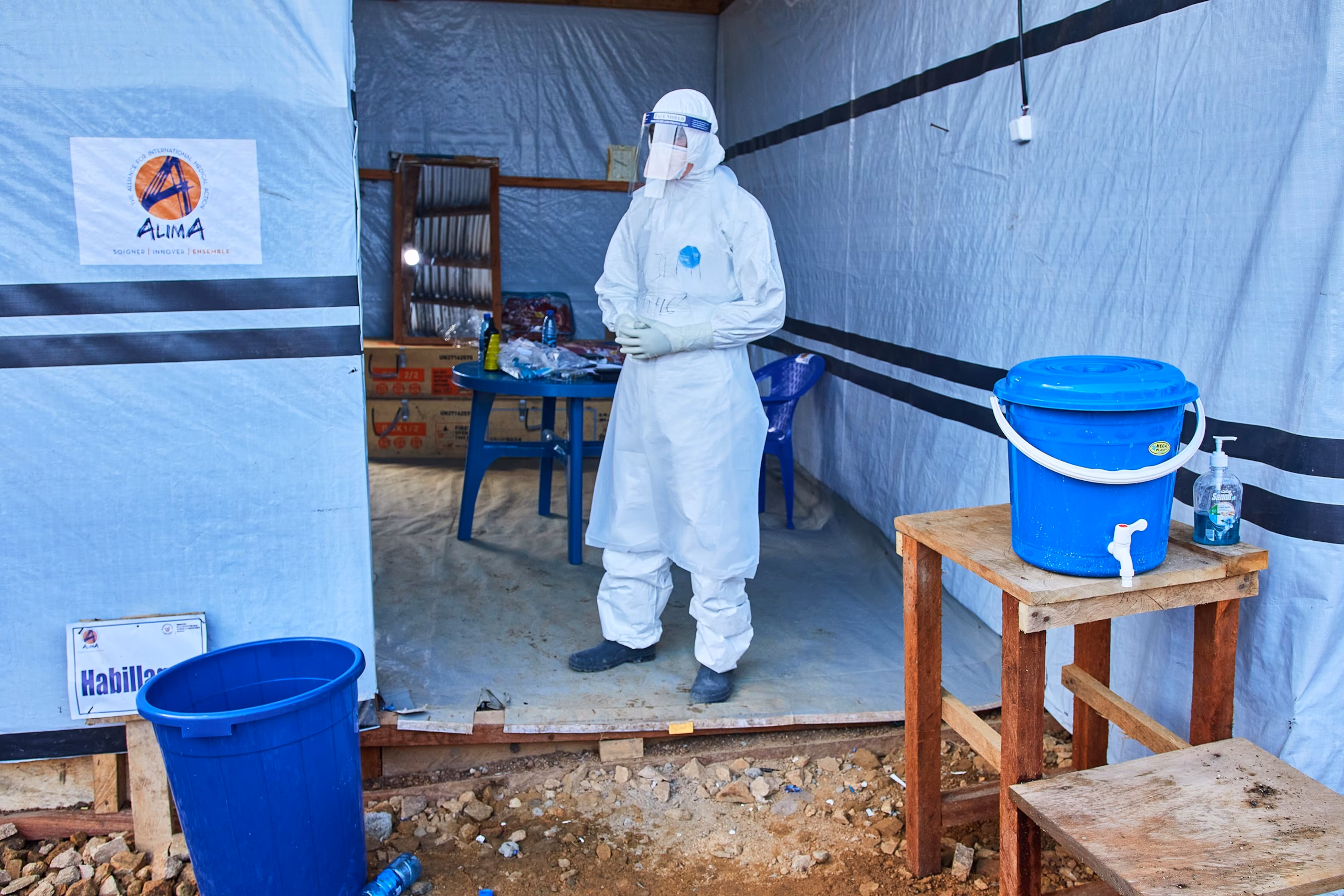 Healthcare workers wearing protective equipment care for Ebola patients at a treatment centre in eastern DR Congo as the outbreak spreads across several provinces.
