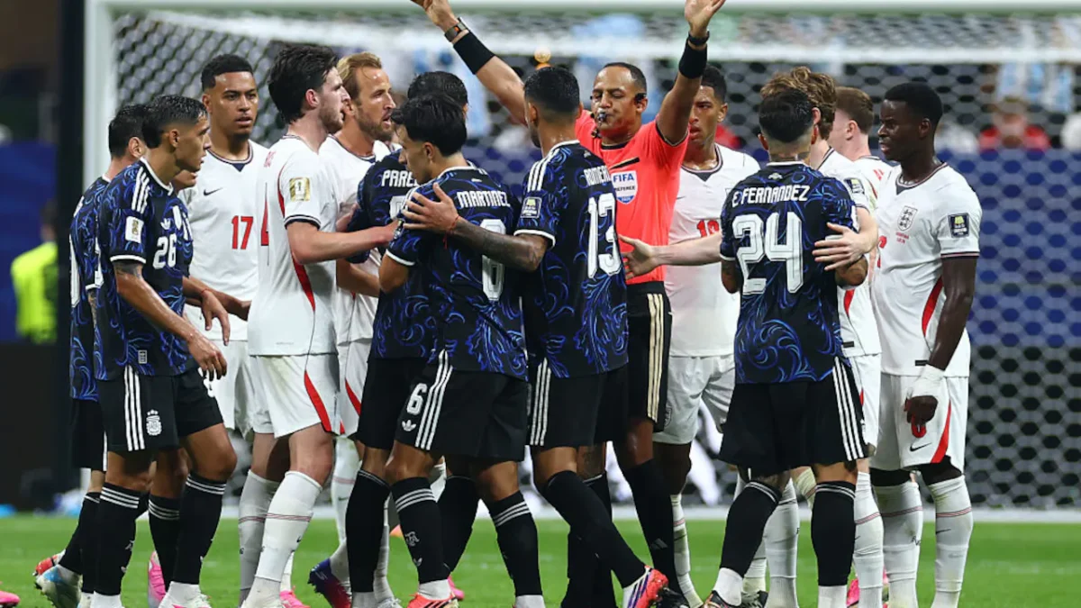 England players react after Lautaro Martínez scores Argentina's stoppage-time winner during the 2026 FIFA World Cup semi-final in Atlanta, following late tactical changes by England.