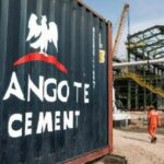 A photo of a Dangote Cement Plc logo on a barrier during ongoing construction at one of the company's plants