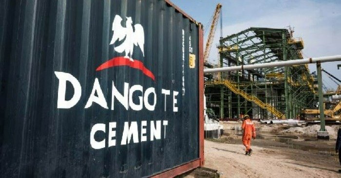 A photo of a Dangote Cement Plc logo on a barrier during ongoing construction at one of the company's plants