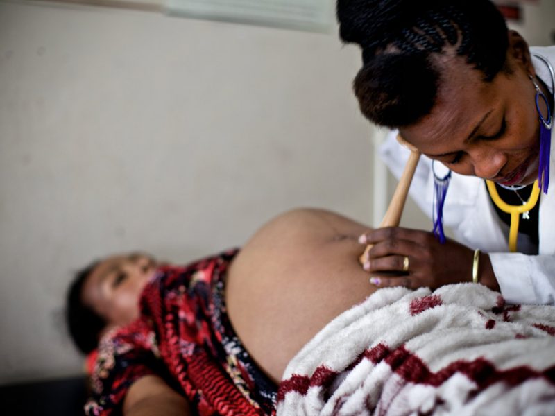 African mothers and newborns receiving healthcare, highlighting the continent’s maternal and child health challenges and the push for better funding and care.