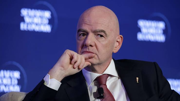 Alt text: FIFA president Gianni Infantino amid controversy over a proposed private investment plan involving the World Cup and Club World Cup.